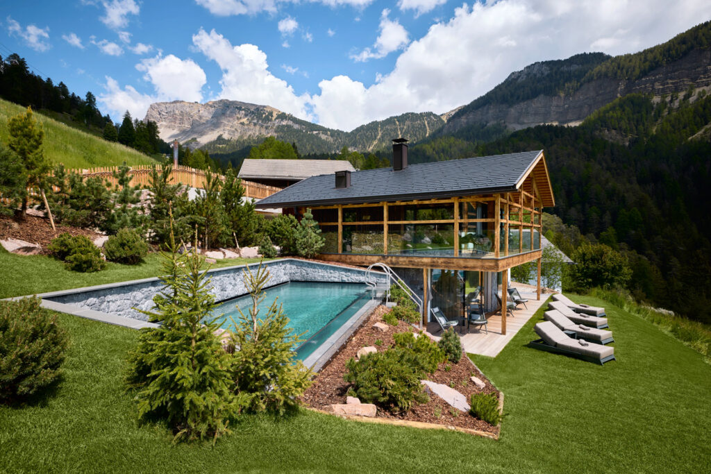 Luxury chalet with private pool in the French Alps surrounded by forest and mountain views